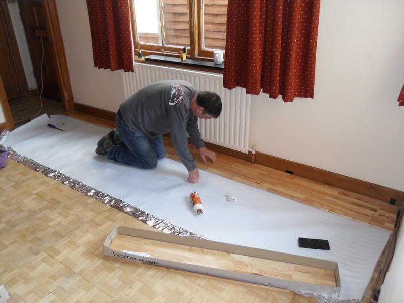 The first boards go down on top of the underlay