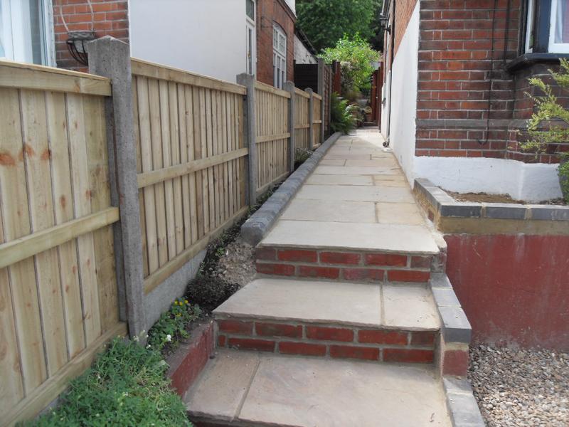 New fence panels looking up the path