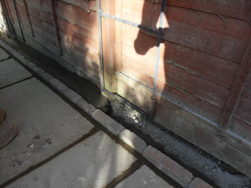 Smooth concrete is put behind the edge stones