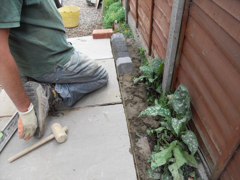 Starting on the edging stones for the front path